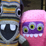 Two Happy Plush Monsters
